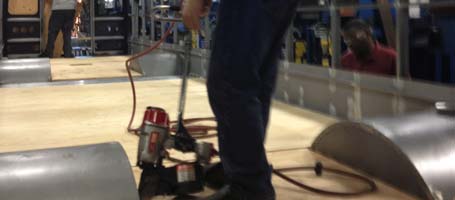 Aerosmith Fasteners being used to fasten plywood to steel for a school bus