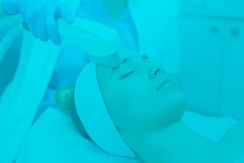 Intense Pulsed Light Therapy (IPL) performed on a woman's face as an anti-aging therapy