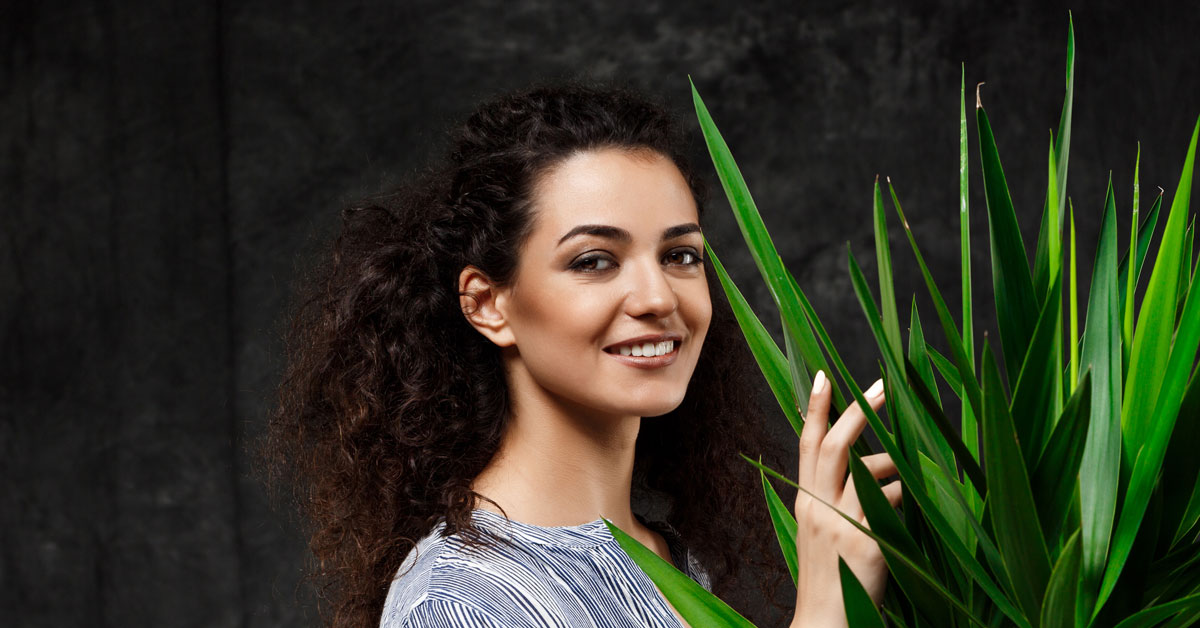 Indian American woman in her 20s with young, healthy looking skin